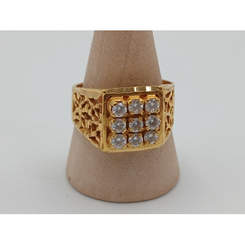 A hallmarked 22ct gold & diamond mens cluster ring featuring ornate cut-out shoulders. Size S.