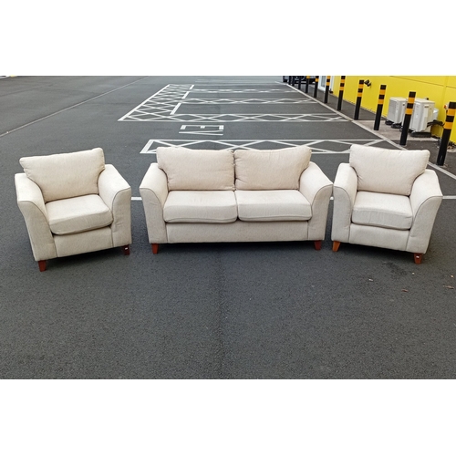Three-piece upholstered suite comprising a two-seat sofa and two armchairs, in oatmeal woven fabric with loose back and seat cushions, shaped track arms, and raised on stained tapering feet. With fire certificates.