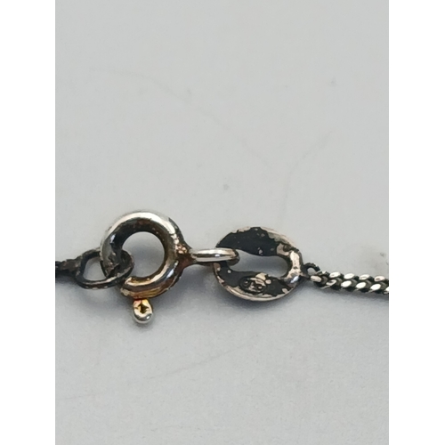 A stamped 925 silver Whale tail necklace. Length 18 inches.
