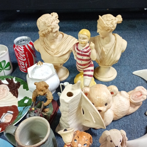 A group of decorative ceramics and figures, including stoneware mugs ...