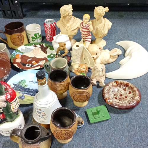 A group of decorative ceramics and figures, including stoneware mugs ...