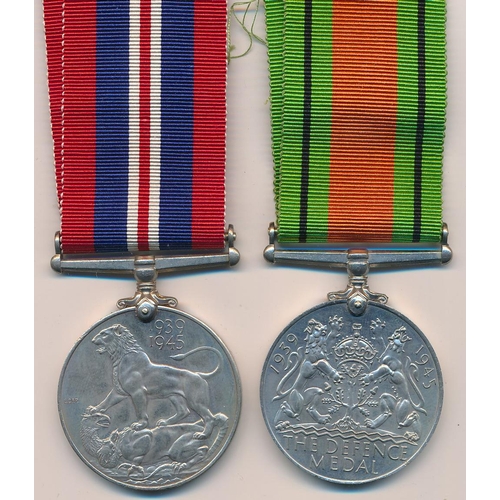 36 - The Defence medal 1939-1945 and The War medal 1935-45, both unnamed. In O.H.M.S Official Paid box ad... 