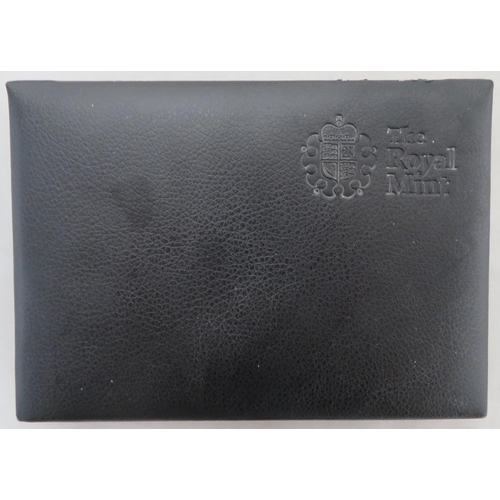 234 - 2011 UK deluxe proof cased set of fourteen coins FDC, black leather edition, including booklet, some... 