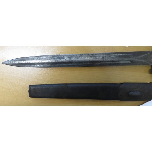 50 - British Victorian bayonet with metal and leather scabbard, marked VR EFD 98, blade length 30cm. Scab... 