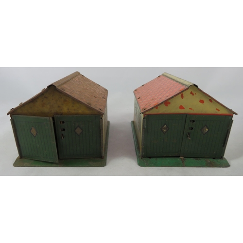 133 - Dinky (Meccano). Pair of tinplate Garages, generally good plus to good (one badly corroded), cream, ... 