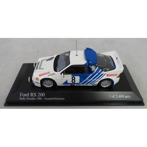 353 - Minichamps. 1/43rd scale Motorsport collection, generally excellent in excellent plastic display cas... 