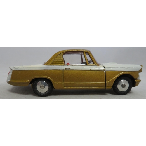 222 - Corgi. Triumph Herald Coupe No. 231, excellent in excellent box, two-tone white and gold, red interi... 