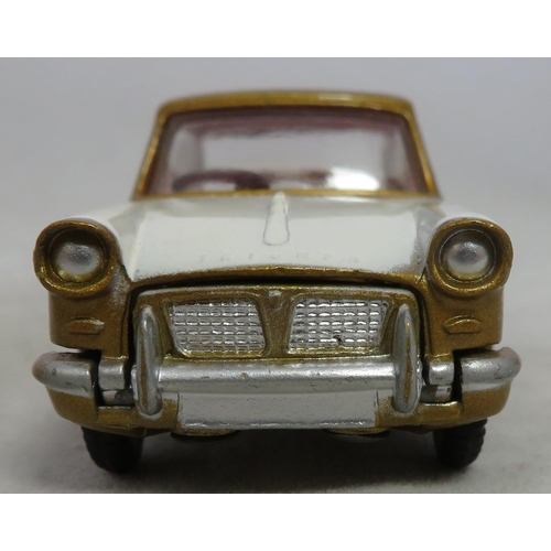 222 - Corgi. Triumph Herald Coupe No. 231, excellent in excellent box, two-tone white and gold, red interi... 