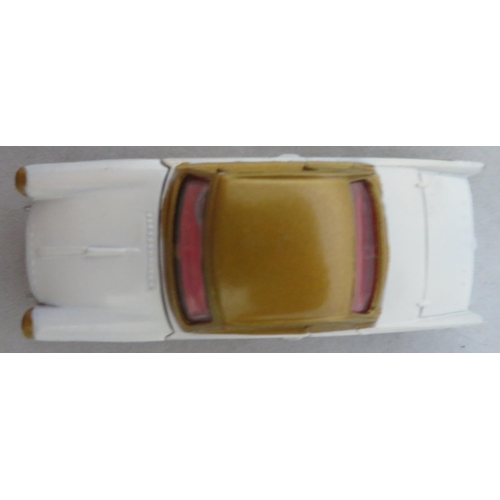 222 - Corgi. Triumph Herald Coupe No. 231, excellent in excellent box, two-tone white and gold, red interi... 