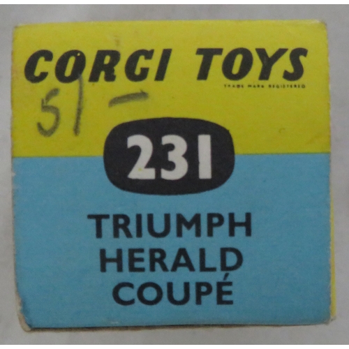 222 - Corgi. Triumph Herald Coupe No. 231, excellent in excellent box, two-tone white and gold, red interi... 