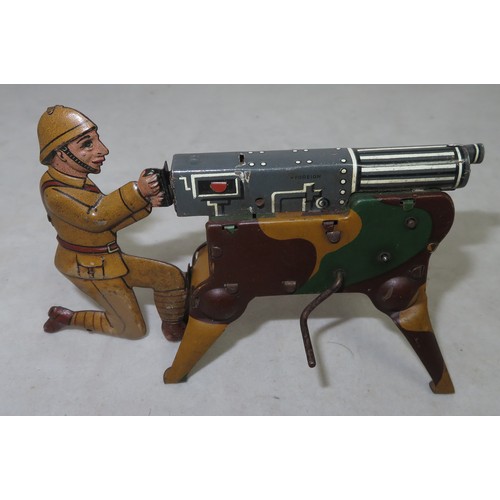 128 - Arnold (Germany). Tinplate Crank Action Machine Gunner, generally excellent to good plus, with spark... 