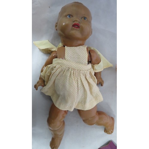 90 - Dolls - 3 vintage dolls comprising of a composite baby doll probably American 1920s to 1940s approx ... 