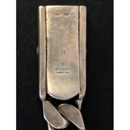 188A - Gucci- a ladies silver curb link bracelet, with fancy box clasp marked 'Gucci' 
Stamped 925. Length ... 