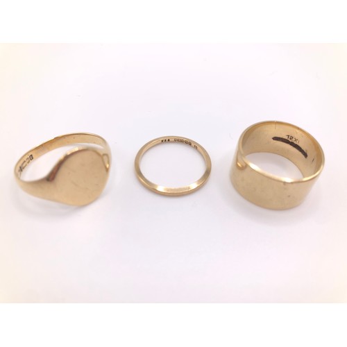 167 - Three 9ct gold rings including:
thinner plain band  - size L
thicker plain band - size M
signet ring... 