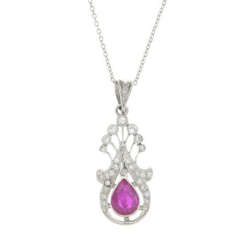 176 - A ruby and diamond openwork pendant suspended from an 18ct white gold chain.
Estimated total diamond... 