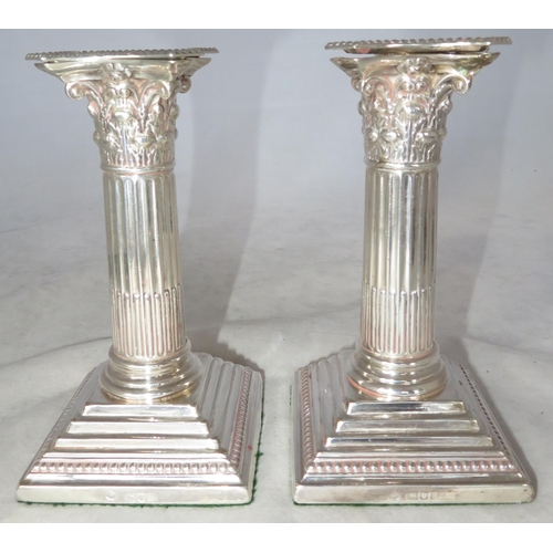 197 - Silver. A pair of sterling silver candlesticks with dimensions 8cm x 8cm x 15cm. Approx weight for p... 