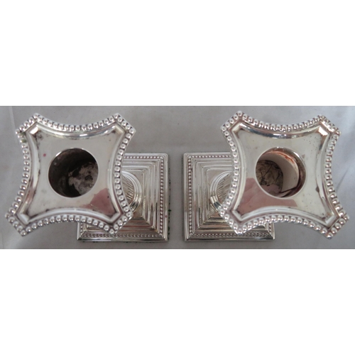 197 - Silver. A pair of sterling silver candlesticks with dimensions 8cm x 8cm x 15cm. Approx weight for p... 