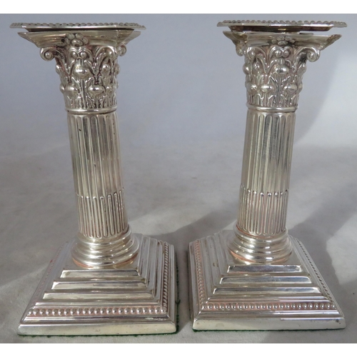 197 - Silver. A pair of sterling silver candlesticks with dimensions 8cm x 8cm x 15cm. Approx weight for p... 