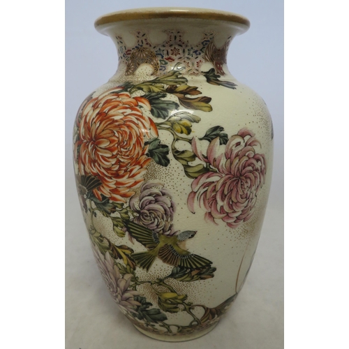 273 - A Japanese satsuma vase decorated with flowers and birds, approx 23cm high.