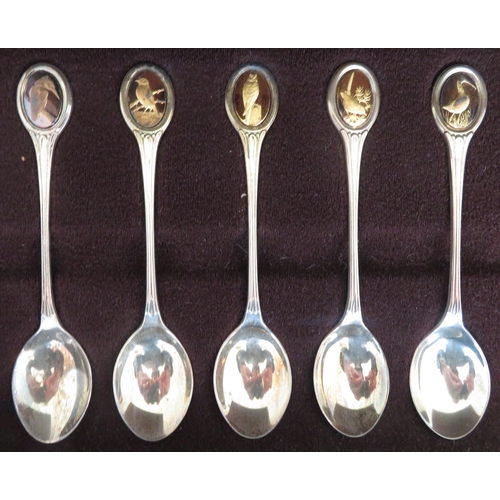 195 - The RSPB Silver Spoon Collection - a set of twelve silver and silver-gilt teaspoons, each set with o... 