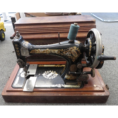 245 - Singer sewing machine, in wooden box. Antique in used condition. Serial number 14666794 (dating 1897... 