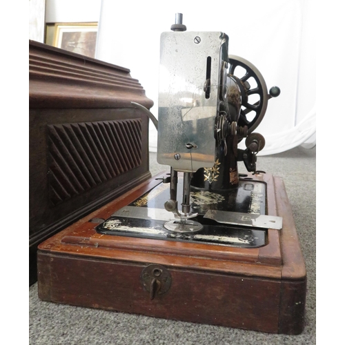 245 - Singer sewing machine, in wooden box. Antique in used condition. Serial number 14666794 (dating 1897... 