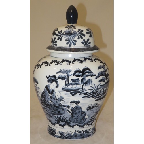 270 - Large oriental blue and white vase depicting two women and a child in a garden setting.
Approx 38cm ... 