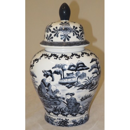 270 - Large oriental blue and white vase depicting two women and a child in a garden setting.
Approx 38cm ... 