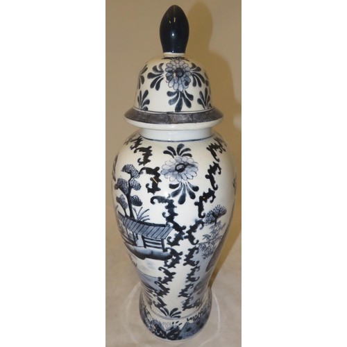 270 - Large oriental blue and white vase depicting two women and a child in a garden setting.
Approx 38cm ... 