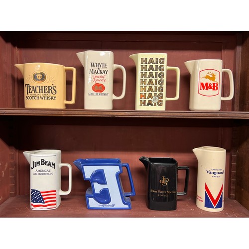 295 - Breweriana. Whisky, beer and tobacco branded pub water jugs (8), including Teacher's, Whyte & Mackay... 