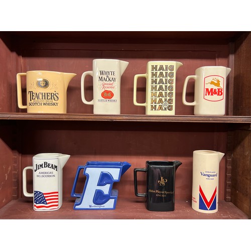 295 - Breweriana. Whisky, beer and tobacco branded pub water jugs (8), including Teacher's, Whyte & Mackay... 