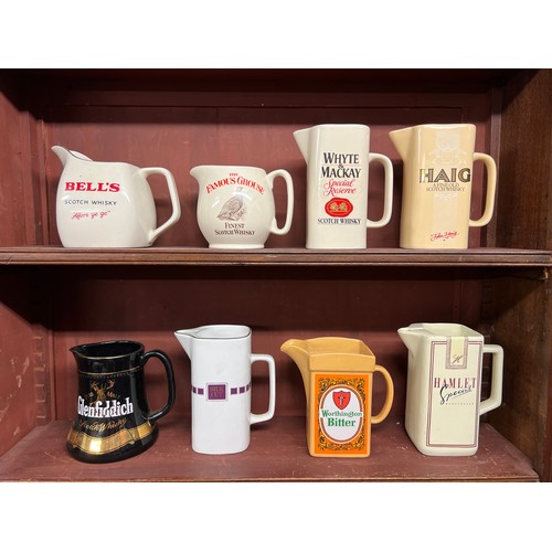 296 - Breweriana. Whisky, beer and tobacco branded pub water jugs (8), including Bell's, Famous Grouse, Wh... 