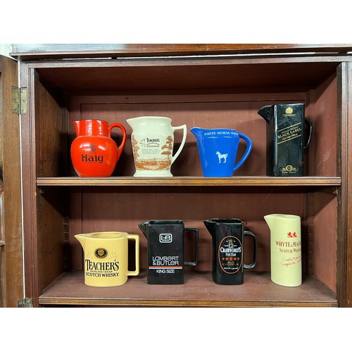 297 - Breweriana. Whisky & tobacco branded pub water jugs (8), including Haig, Teacher's (2 different), Wh... 