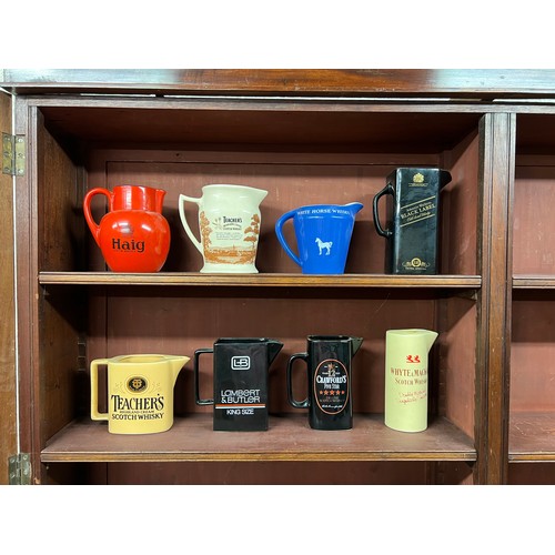 297 - Breweriana. Whisky & tobacco branded pub water jugs (8), including Haig, Teacher's (2 different), Wh... 