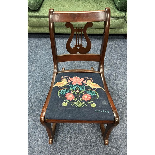 353 - Wooden rocking chair with embroidered seat upholstery featuring two birds and flowers with 