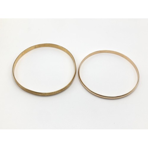 185 - Two 9ct gold bangles, in cases. One fully hallmarked, one stamped 9ct.  Total weight 23.4g