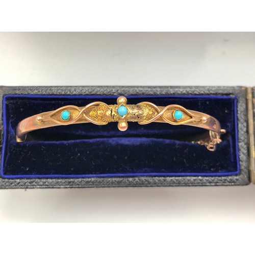 186 - A 9ct gold and turquoise hinged bangle in case, stamped 375.  AF.
Also an opal and blue gemstone cha... 