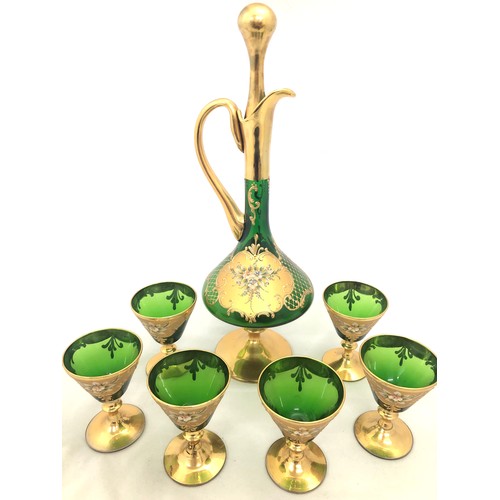 307 - Bohemian Glass – Large decanter including topper with six matching glasses in green glass, gilt fini... 