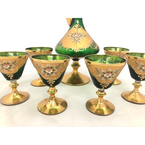 307 - Bohemian Glass – Large decanter including topper with six matching glasses in green glass, gilt fini... 