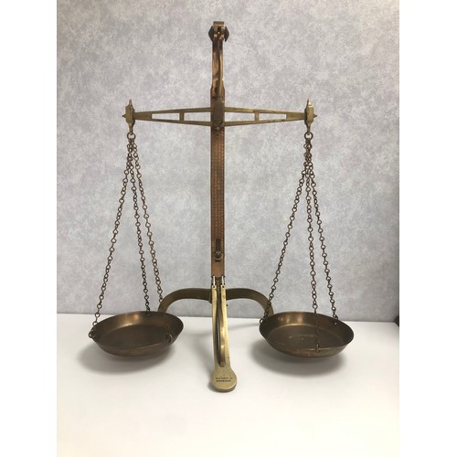 204 - A set of brass scales by W & T Avery Ltd of Birmingham, the scales approx 60cm high.
Also, a wooden ... 