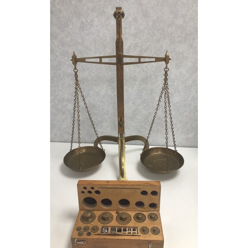 204 - A set of brass scales by W & T Avery Ltd of Birmingham, the scales approx 60cm high.
Also, a wooden ... 