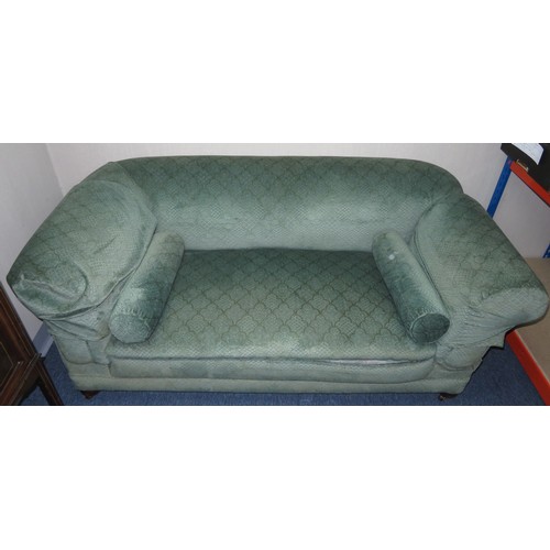 348 - Chesterfield drop-arm settee with wood legs and brass castors.