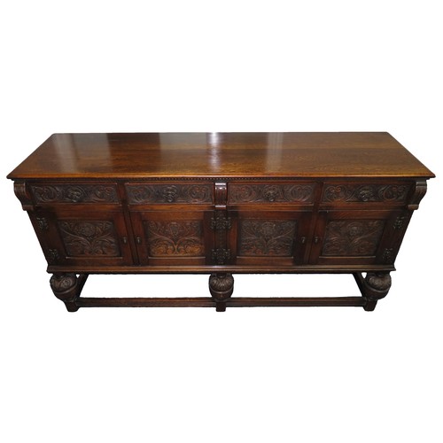 343 - A large 19th/20th century decorative oak sideboard, with four doors, four drawers and a removable sh... 