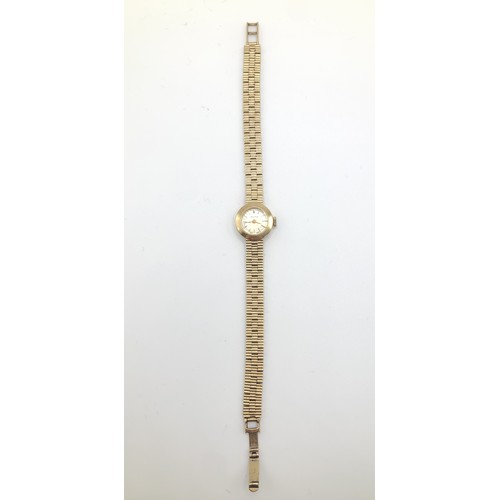 157 - Watch - A Swiss made 9ct gold Marvin ladies watch on a 9ct gold bracelet. Stamped N&TLtd and fully h... 