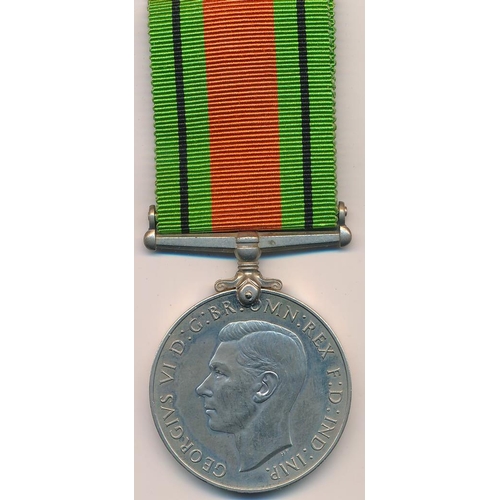 28 - Second World War - Three medals including The Defence medal 1939-45. In O.H.M.S Official Paid box ad... 