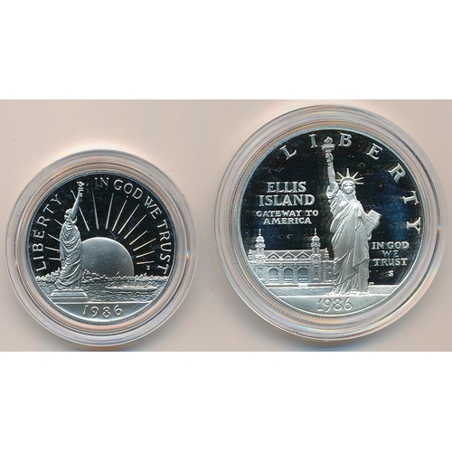 319 - 1986 Liberty silver dollar and (CuNi) half dollar cased set with COA.