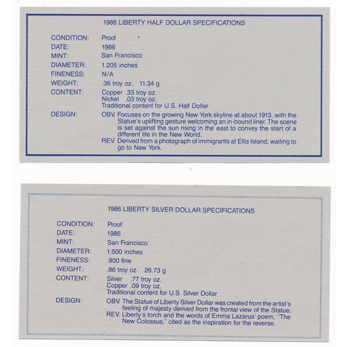 319 - 1986 Liberty silver dollar and (CuNi) half dollar cased set with COA.