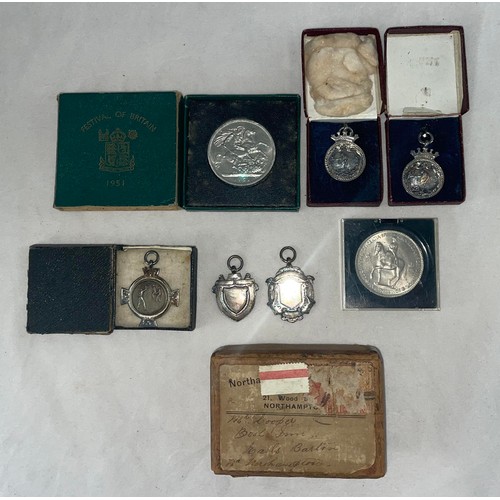 135 - Cricket medallions, a small selection of five silver early 20th century cricket medallion fobs (thre... 