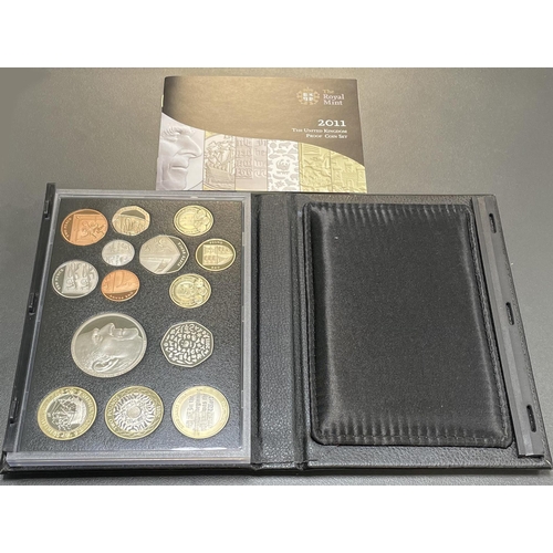 253 - 2011 UK deluxe proof cased set of 14 coins FDC, black leather edition, including booklet.