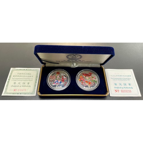 294 - China – The Peoples Bank of China 10 Yuan Greeting of Spring silver 1oz coloured coin pair. With cer... 